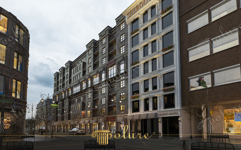 Koyu tuğla duvarlı otel cephesinde beyaz poliüretan söve ve pilaster sütun süsleme detayları.